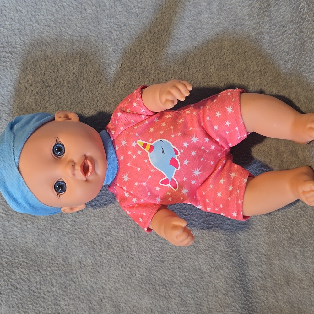 Adorable Pink Baby Doll with Blue Hat